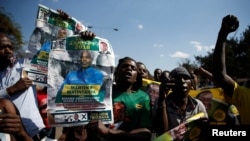 Supporters of the ruling ZANU-PF party of President Emmerson Mnangagwa celebrate following general elections in Harare, Zimbabwe, July 31, 2018. 