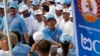 Cambodian Prime Minister Hun Sen, center, greets his supporters during his Cambodian People's Party's last campaign for the July 29 general election, in Phnom Penh, Cambodia, Friday, July 27, 2018. 