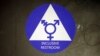 FILE - A sticker designates a gender-neutral bathroom at Nathan Hale High Cchool, May 17, 2016, in Seattle, Washington.