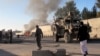 Smoke bellows after a suicide car bomb blast attacked a military convoy in Lashkar Gah, Helmand province, Afghanistan, Nov. 15, 2015.