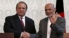 FILE - Afghan President Ashraf Ghani (R) shakes hands with Pakistani Prime Minister Nawaz Sharif after a news conference in Kabul, May 12, 2015. Leaders are expected to hold an “icebreaking” meeting on the margins of the U.N. climate change summit that starts on Nov. 30 in Paris, France.