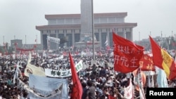 FILE: Hundreds of thousands of people, seeking political and economic reforms, crowded Beijing’s central Tiananmen Square, May 17, 1989.