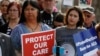State Sen. Dr. Irene Aguilar, D-Denver, left, stands with activist Christina Postolowski, of the group Young Invincibles, as supporters of the Affordable Care Act who are also opponents of Colorado's GOP-led plan to undo Colorado's state-run insurance exc