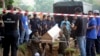Malaysian officials provide Muslim burial to 21 human trafficking victims, believed to be Rohingya Muslim refugees, found in shallow graves in jungles bordering Thailand, in Kedah, Malaysia, June 22, 2015.