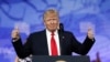 FILE - President Donald Trump gives thumbs up as he arrives to speak at the Conservative Political Action Conference, Feb. 24, 2017, in Oxon Hill, Maryland.