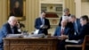 FILE - U.S. President Donald Trump (L-R), joined by Chief of Staff Reince Priebus, VP Mike Pence, senior advisor Steve Bannon, Communications Director Sean Spicer and National Security Advisor Michael Flynn, speaks by phone with Russia's President Vladimir Putin in the Oval Office, the White House, Washington, Jan. 28, 2017.