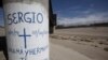 FILE - Graffiti is seen at the site where Sergio Hernandez was shot dead in 2010 under a railroad bridge connecting El Paso with Ciudad Juarez, July 1, 2014.