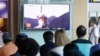 People watch a TV news program showing a file footage of North Korea's ballistic missile that the North claimed to have launched from underwater, at Seoul Railway station in Seoul, South Korea, July 9, 2016.