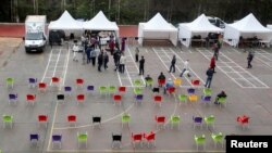FILE - A general view shows an outdoor market set up by the Algerian government to prevent crowding inside supermarkets, in Algiers, Algeria, April 19, 2020.